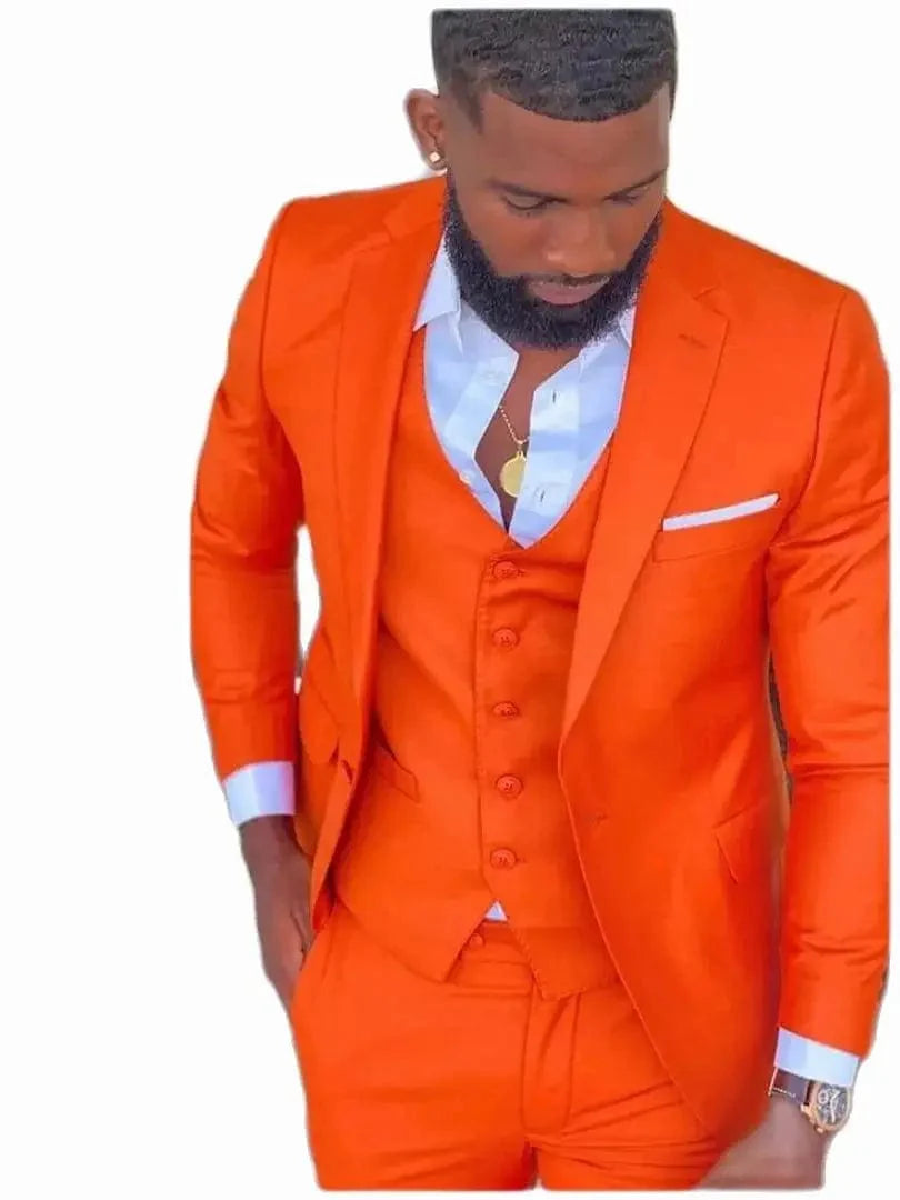 Bright orange slim fit men's 3-piece suit with notch lapel, shown on a mannequin, ideal for wedding or prom events.