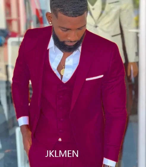 Bright orange slim fit men's 3-piece tuxedo with notch lapel, tailored for weddings, prom, or formal events.