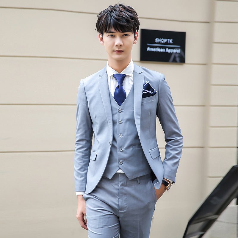 Pink three-piece slim fit men's suit with solid color, featuring jacket, vest, and trousers for business or formal occasions.