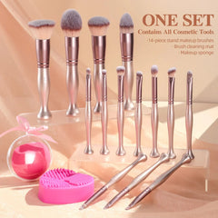 A 14-piece set of rose gold makeup brushes with a cleaning mat and a makeup sponge.