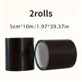 Black PVC cloth repair tape by SHOWLU FASHION STORE, waterproof and durable, shown rolled out on a flat surface.