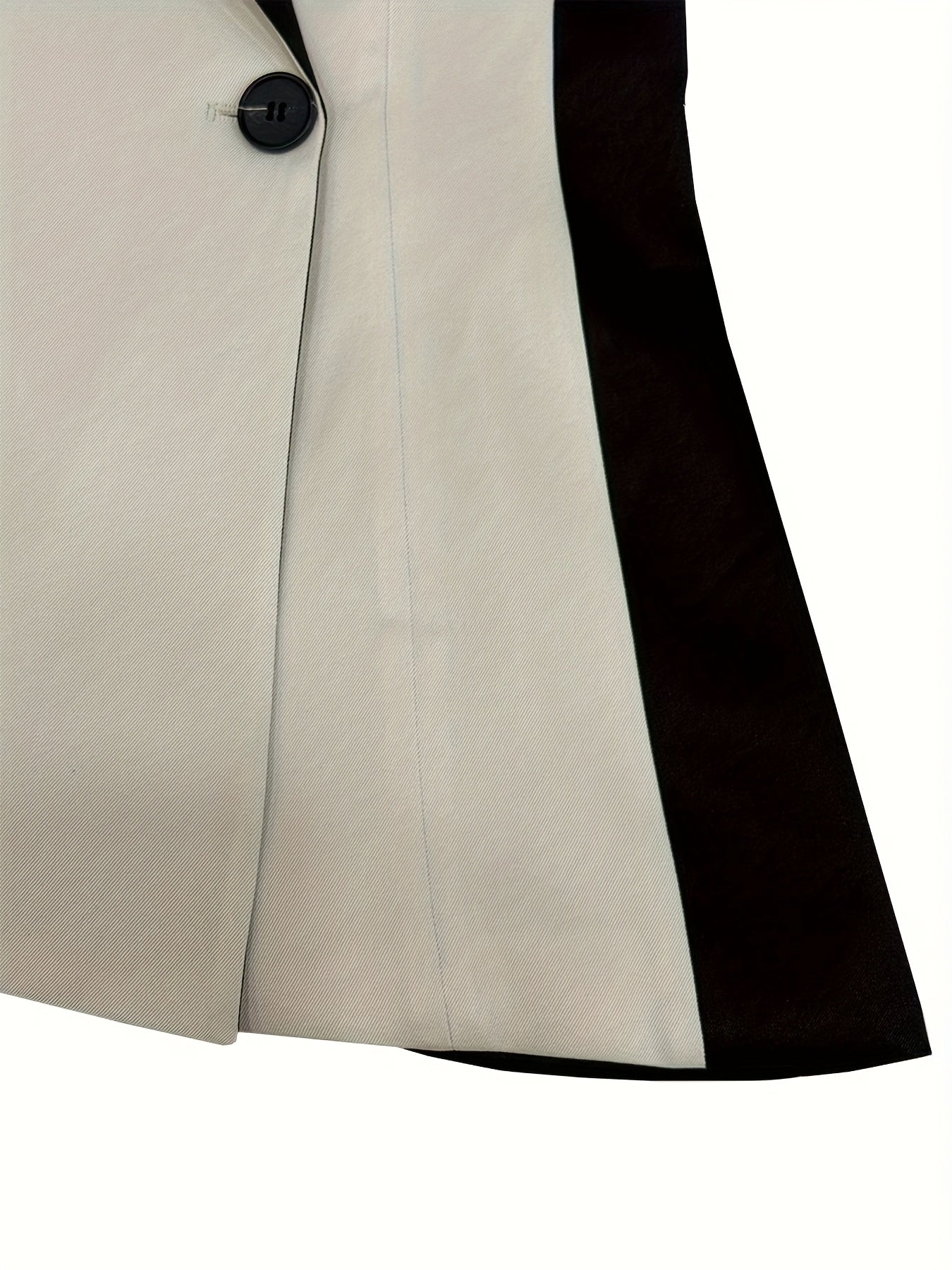 SHOWLU Women's asymmetrical two-tone color-block blazer jacket, featuring a modern design with contrasting panels and tailored fit.