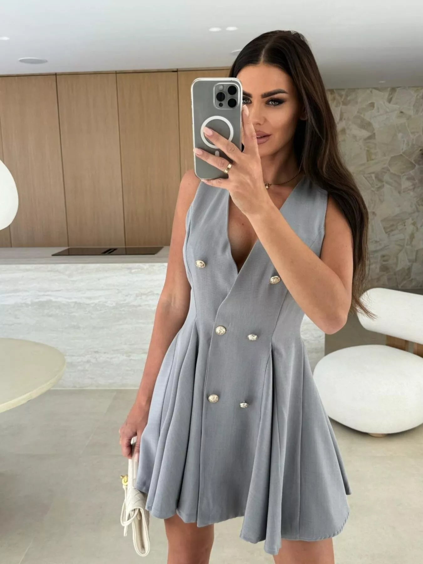 Double-breasted V-neck mini dress by Trendsi, featuring a fitted silhouette and stylish design, displayed on a mannequin.