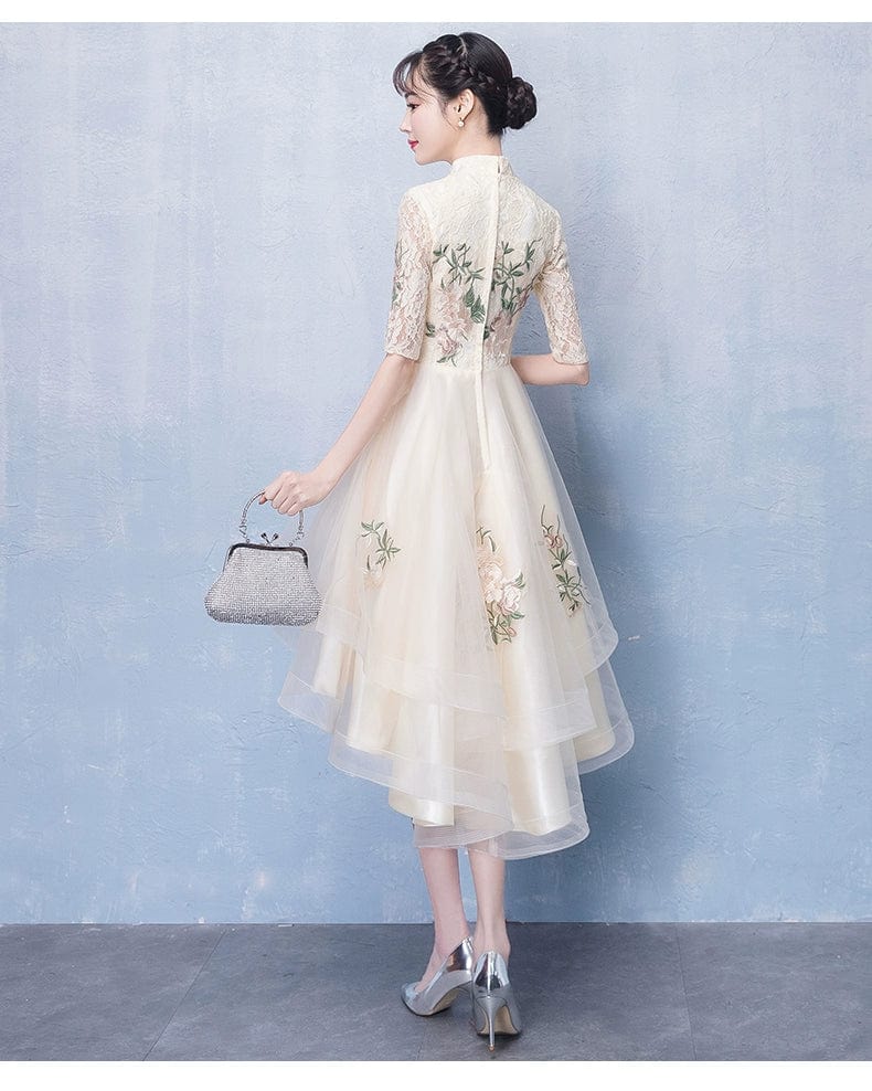 Champagne-colored embroidered evening gown by Showlu Fashion, mid-length dress with elegant musical and artistic design details.