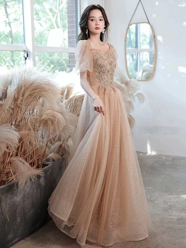 Champagne-colored Showlu Fashion evening gown with elegant embroidery, mid-length design, perfect for formal events and special occasions.