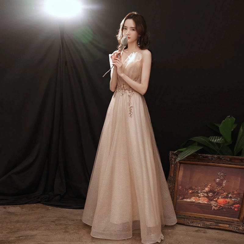 Champagne embroidered evening gown by Showlu Fashion featuring elegant mid-length design and musical-inspired artistic details