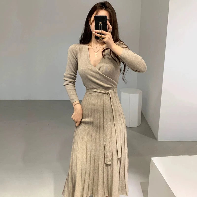 SHOWLU FASHION slimming pleated knit maxi dress with V-neck and long sleeves, featuring chic cross lace-up detail.