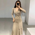 SHOWLU FASHION slimming pleated knit maxi dress with V-neck and long sleeves, featuring chic cross lace-up detail.