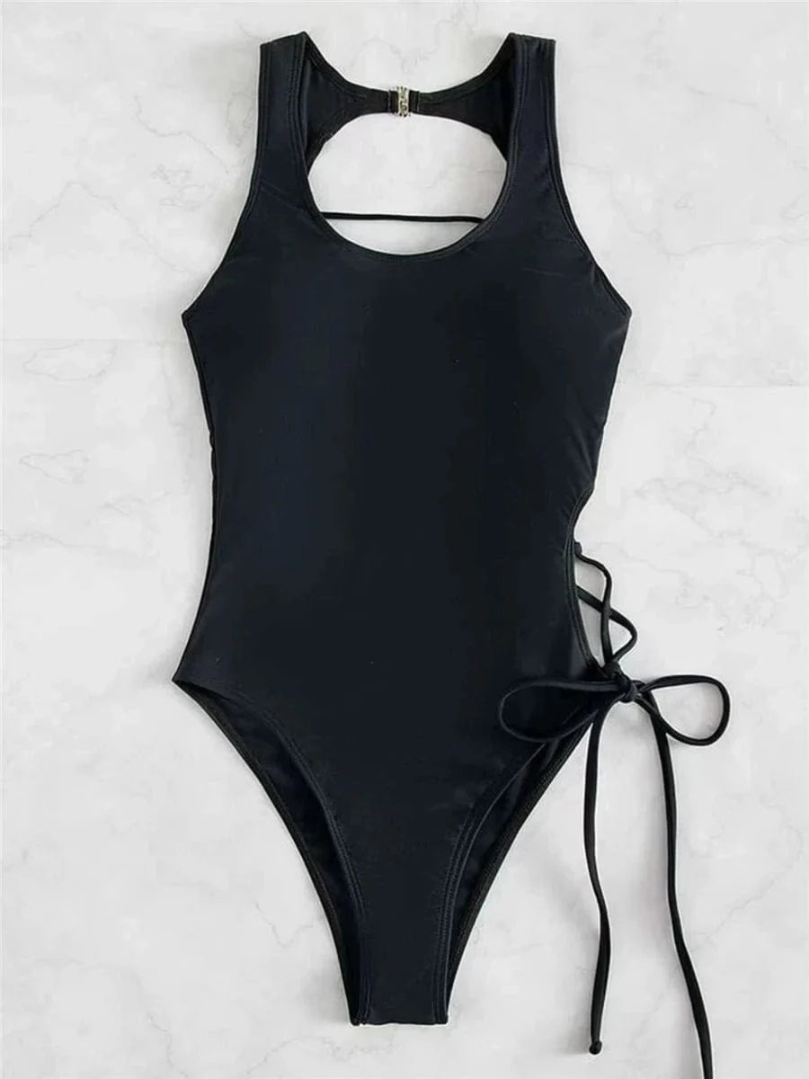 Chic women's lace-up backless printed one-piece swimsuit by Showlu Fashion, featuring a stylish design and vibrant print.
