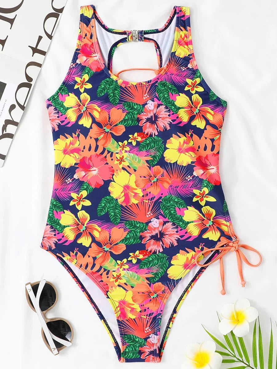 Showlu Fashion women's backless printed one-piece swimsuit with lace-up detail, stylish and suitable for beach or pool wear.