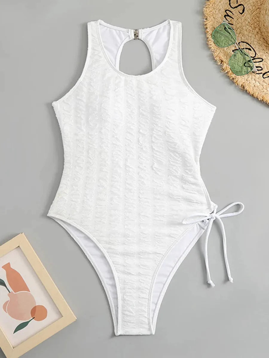 Showlu Fashion women's backless printed one-piece swimsuit with lace-up detail, stylish and suitable for beach or poolwear.