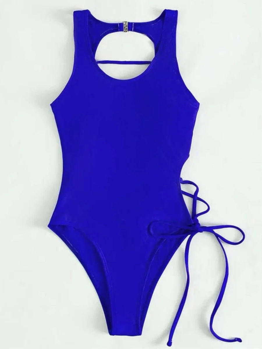 Showlu Fashion women's backless printed one-piece swimsuit with lace-up detail, stylish and perfect for beach or poolside.