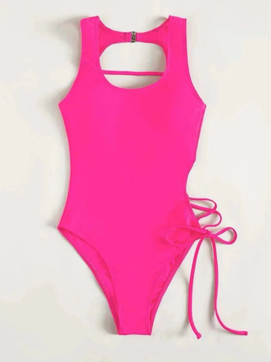 Showlu Fashion women's backless printed one-piece swimsuit with lace-up back detail, ideal for stylish beach or pool days.