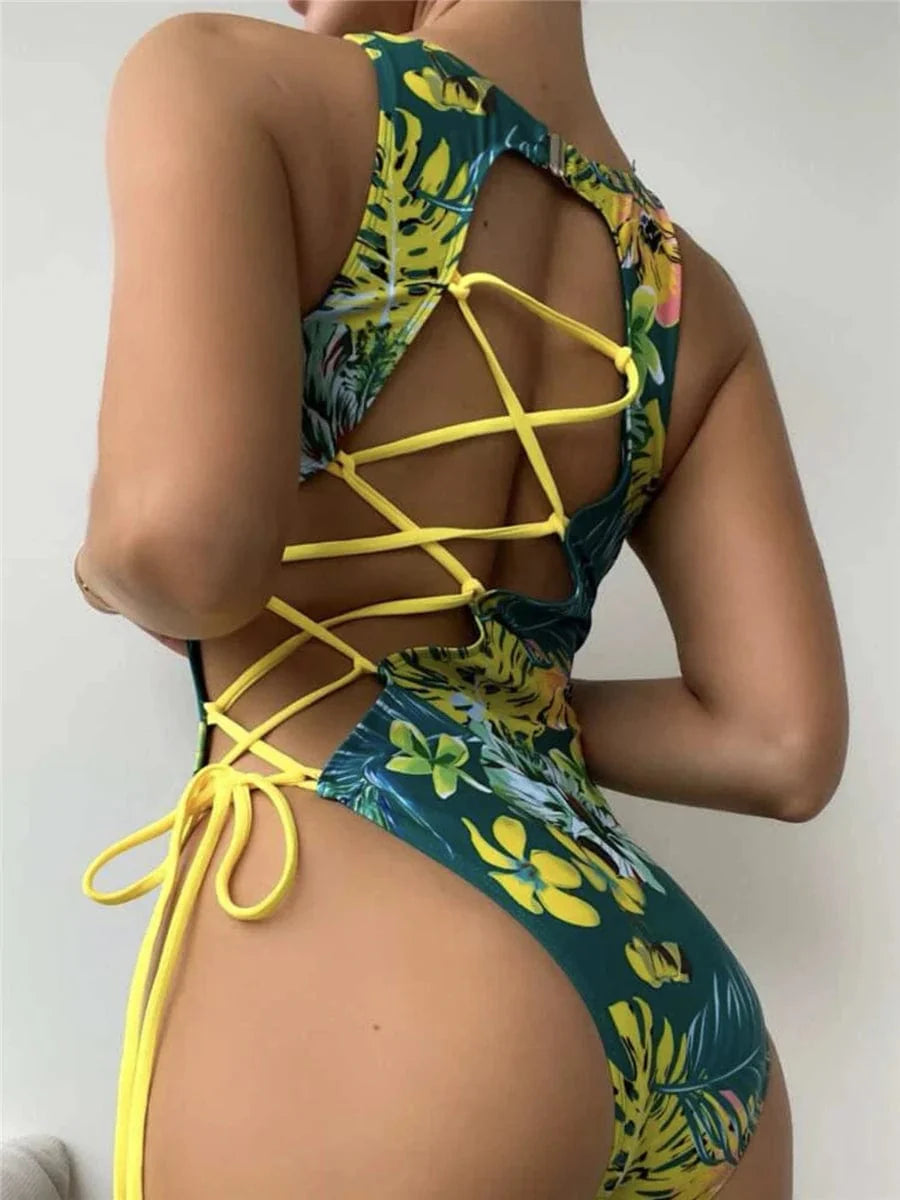 Chic women's backless one-piece swimsuit with lace-up back and printed design by Showlu Fashion.