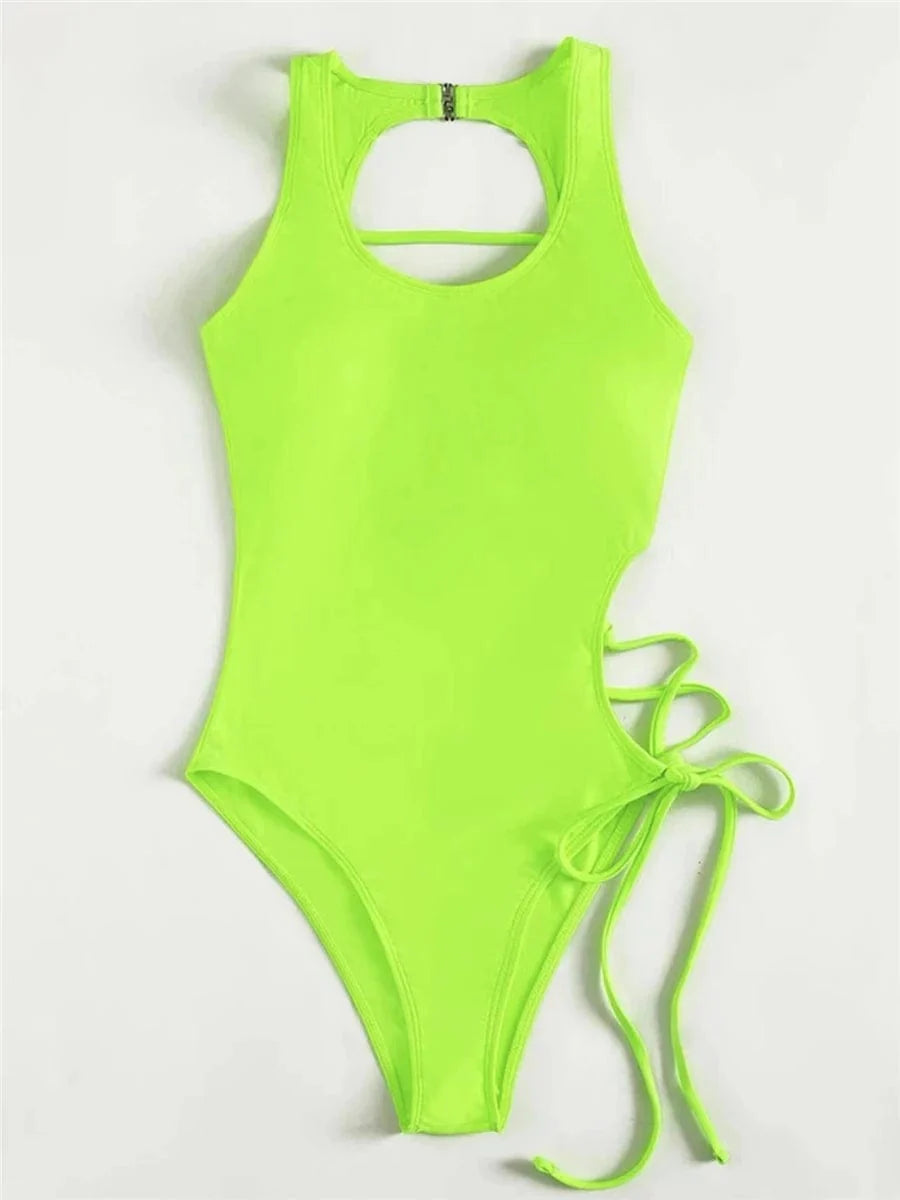 Chic Showlu Fashion women's backless printed one-piece swimsuit with lace-up detail, stylish and perfect for beach or pool.
