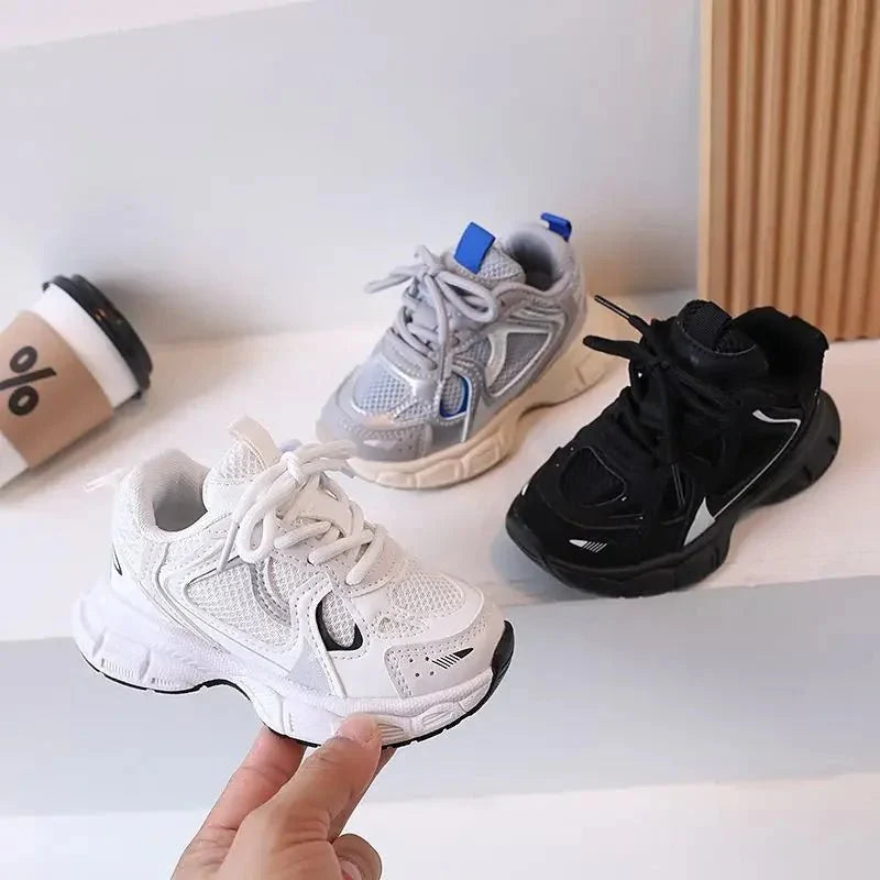 Children's Showlu Kids Tennis Shoes in white, breathable sneakers with non-slip soles for boys and girls, casual and sporty style.
