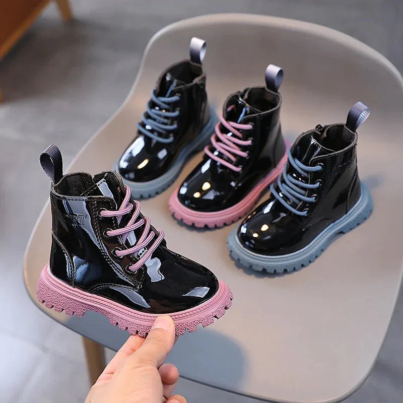 Showlu Fashion kids ankle boots in shiny PU leather, unisex short boots for boys and girls with solid color design.