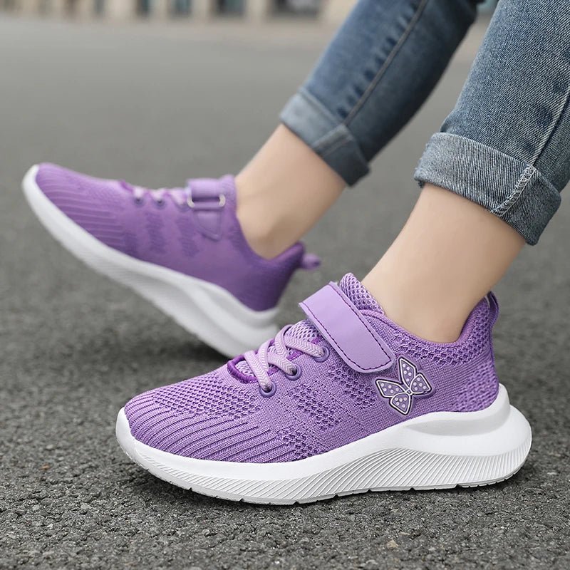 Girls' breathable mesh running shoes by Showlu Fashion with anti-slip soles, designed for outdoor sports and active leisure.