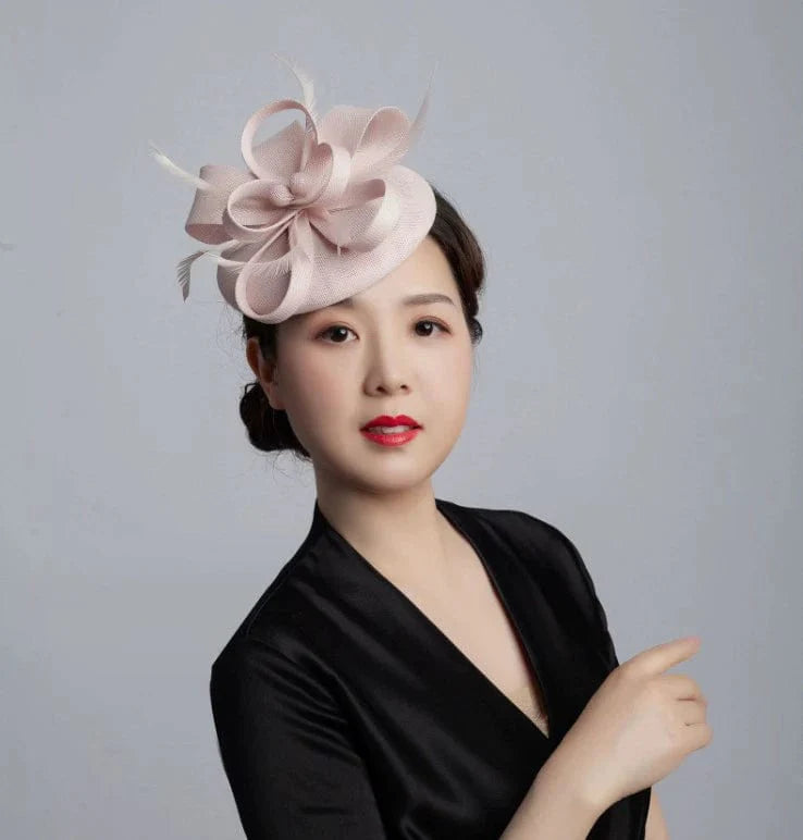 Vintage linen topper hat with elegant floral design, perfect for wedding headwear, shown on a classic-style bride.