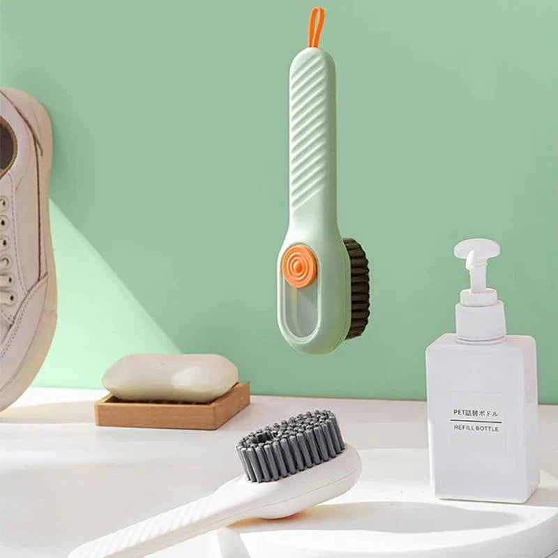 Showlu Soft Bristle Liquid Shoe Brush with long handle for cleaning shoes, clothing, and household surfaces effectively.