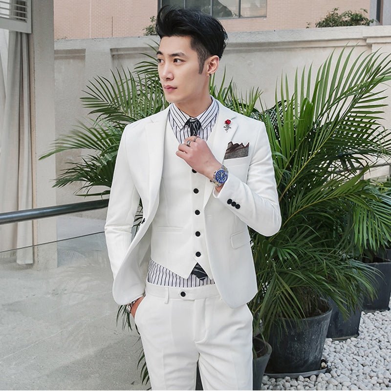 Slim-fit men's three-piece wedding suit in a stylish Korean design, featuring a classic jacket, vest, and trousers.