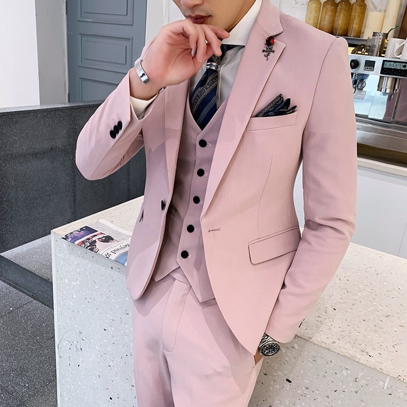 Slim-fit three-piece men's wedding suit in a casual Korean style, featuring a jacket, vest, and trousers worn by a handsome groom.