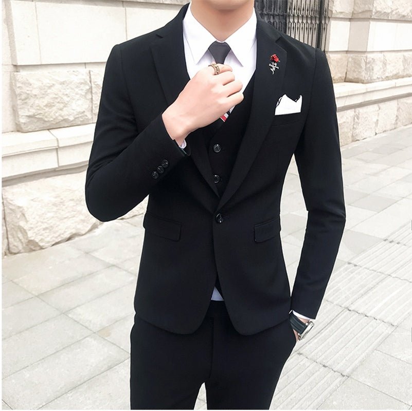 Slim-fit three-piece men's wedding suit in a casual Korean style, shown in a neutral color with a tailored fit and modern design.