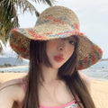 Woven straw women's summer seaside sun hat with a big brim, perfect for beach and vacation fashion by Showlu Fashion.