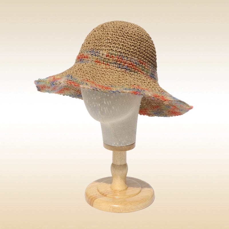 Woven straw women's summer beach sun hat with a wide brim, perfect for seaside vacation and outdoor sun protection.