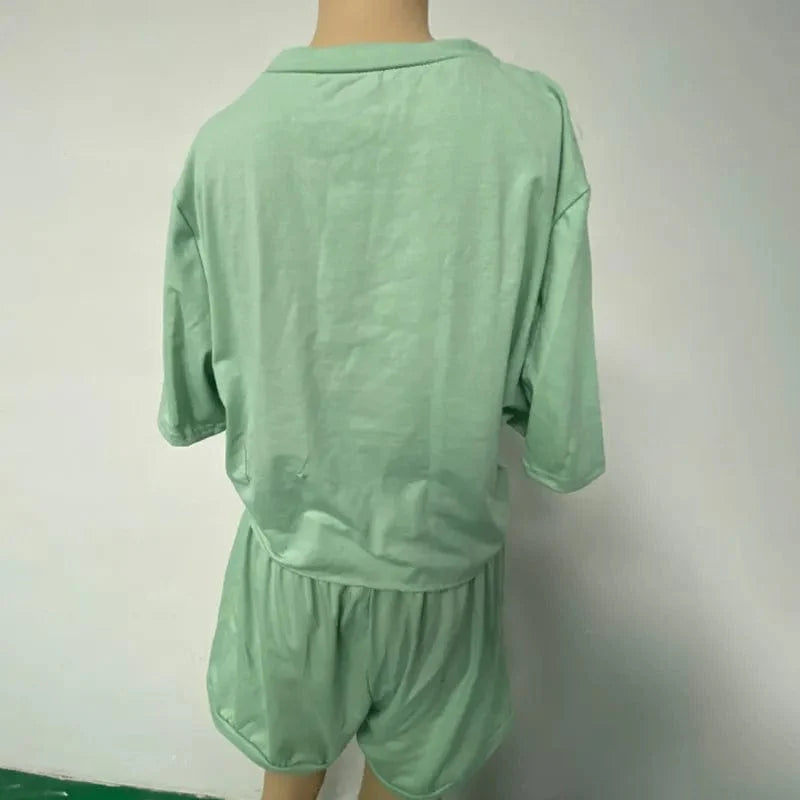 Showlu Women's casual summer two-piece suit with crew neck short sleeve top and matching shorts, perfect for warm weather.