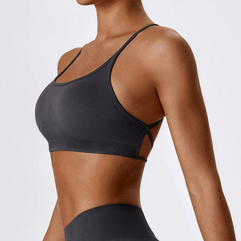 Showlu Seamless Cross Back Yoga Bra in quick-dry nylon with supportive braces and sleek back design for active wear.
