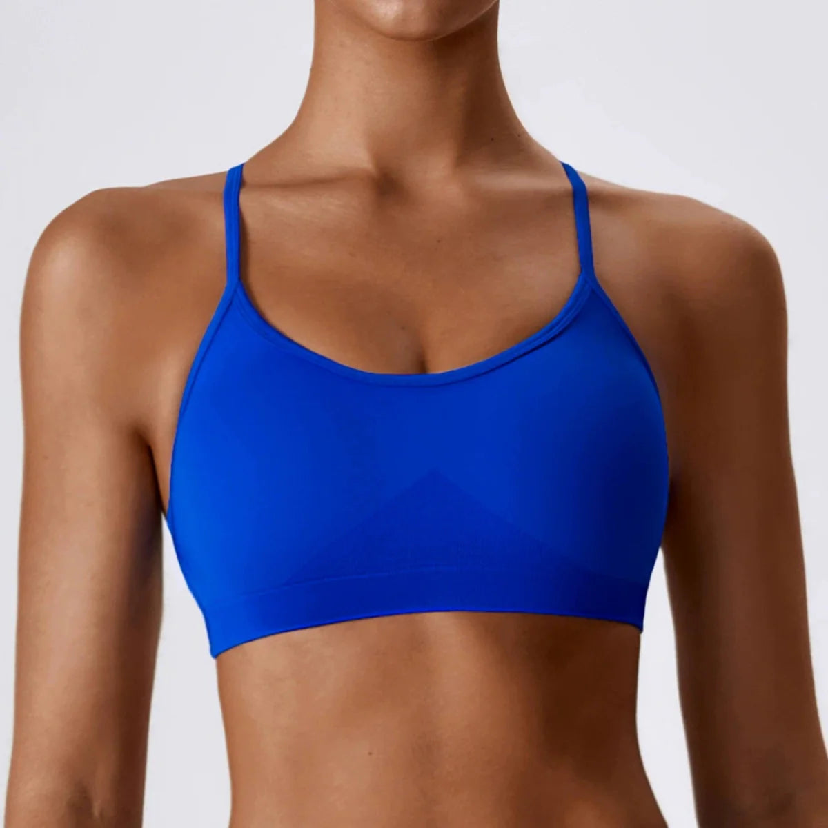 Showlu Seamless Cross Back Yoga Bra in quick-dry nylon, featuring a supportive fit and stylish back design for active wear.