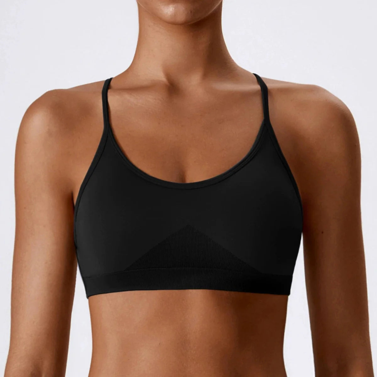 Showlu Seamless Cross Back Yoga Bra in quick-dry nylon with supportive braces and a stylish open back design for active wear.