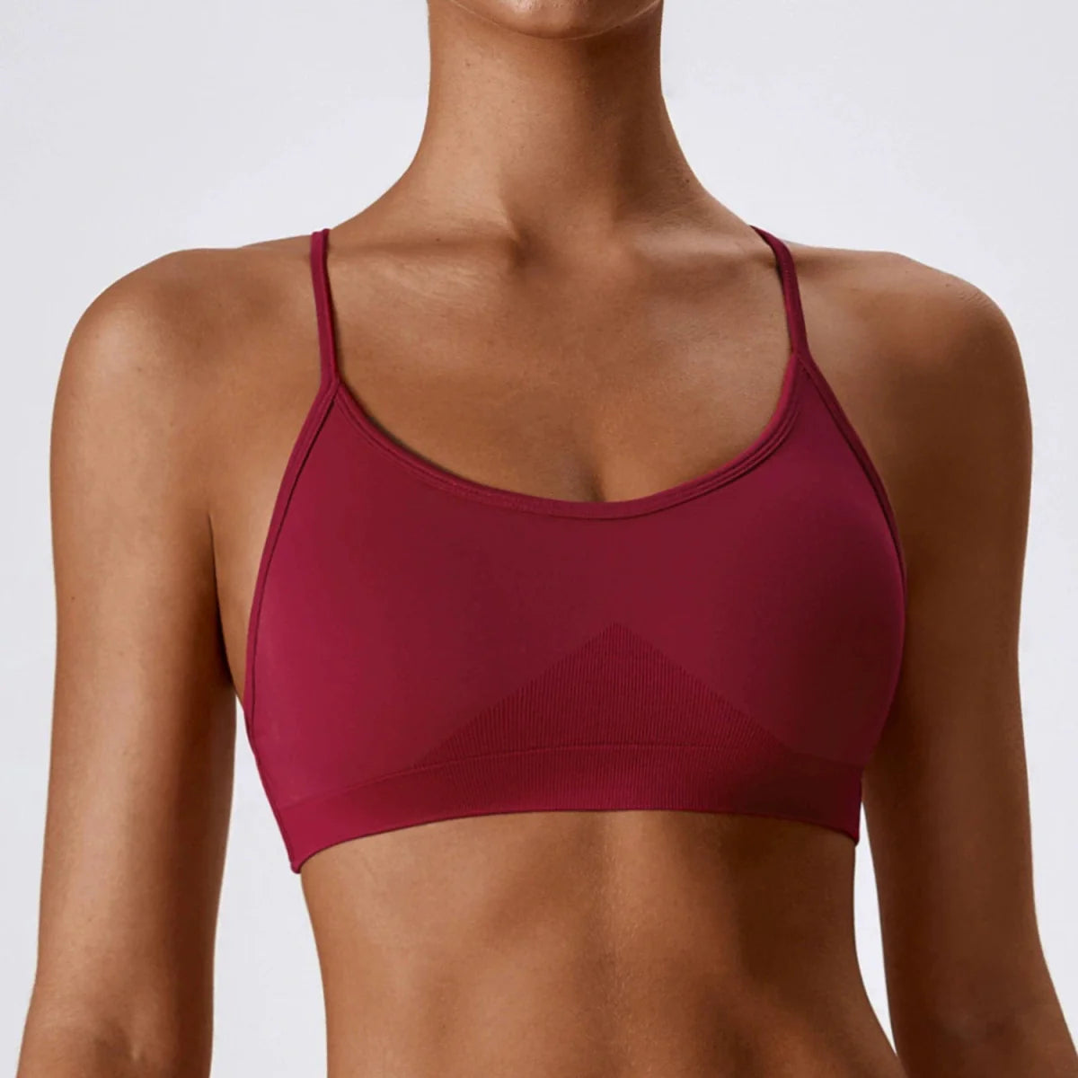 Showlu Seamless Cross Back Yoga Bra in quick-dry nylon with supportive braces and stylish back design for comfortable workout wear.