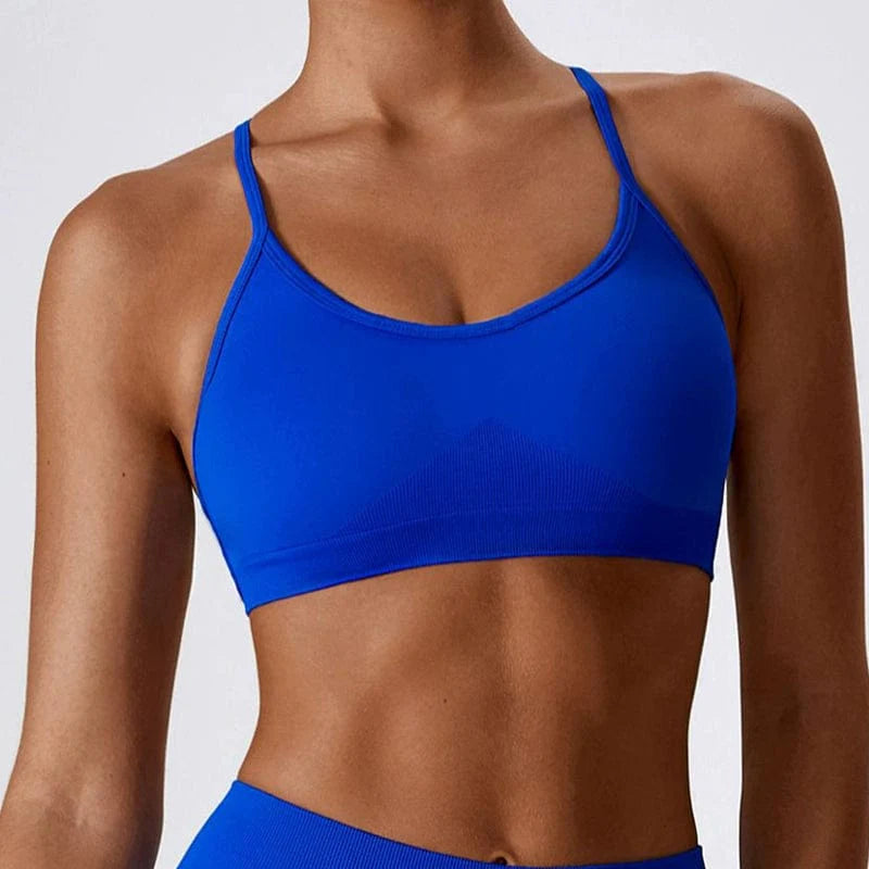 Showlu Seamless Cross Back Yoga Bra in quick-dry nylon with tight braces and a stylish back design, ideal for active wear.