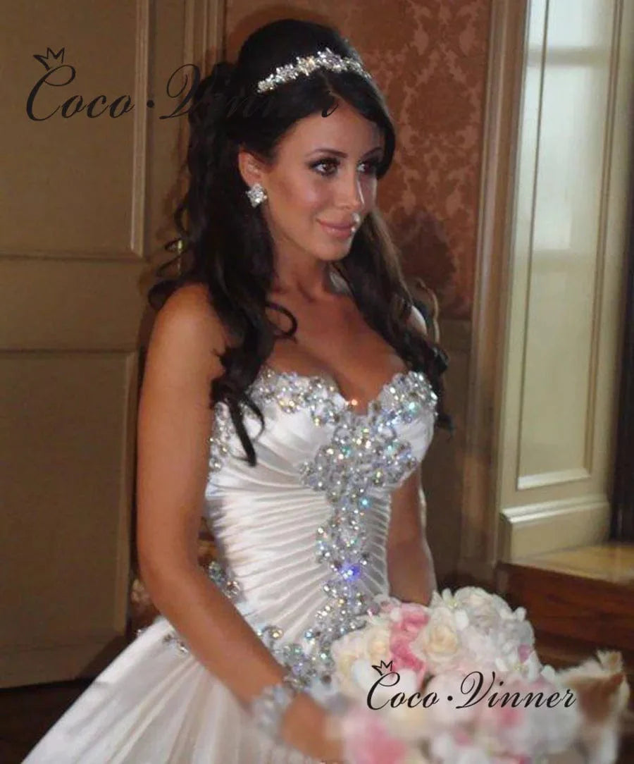 Elegant satin ball gown wedding dress by SHOWLU FASHION with crystal beading and a sweetheart neckline, perfect for bridal occasions.