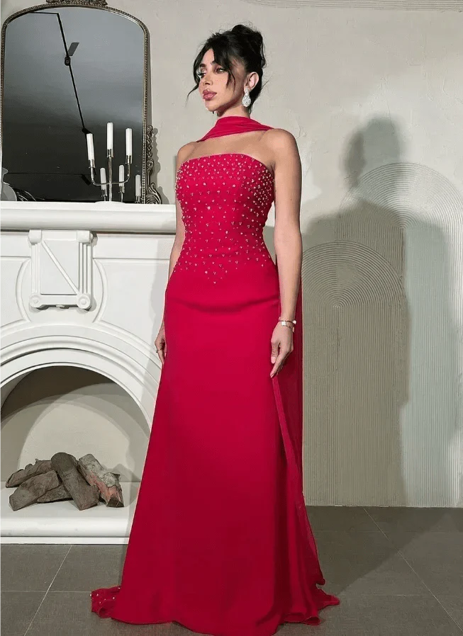 Beaded satin sleeveless A-line evening gown with a floor-length design, perfect for formal events and elegant occasions.