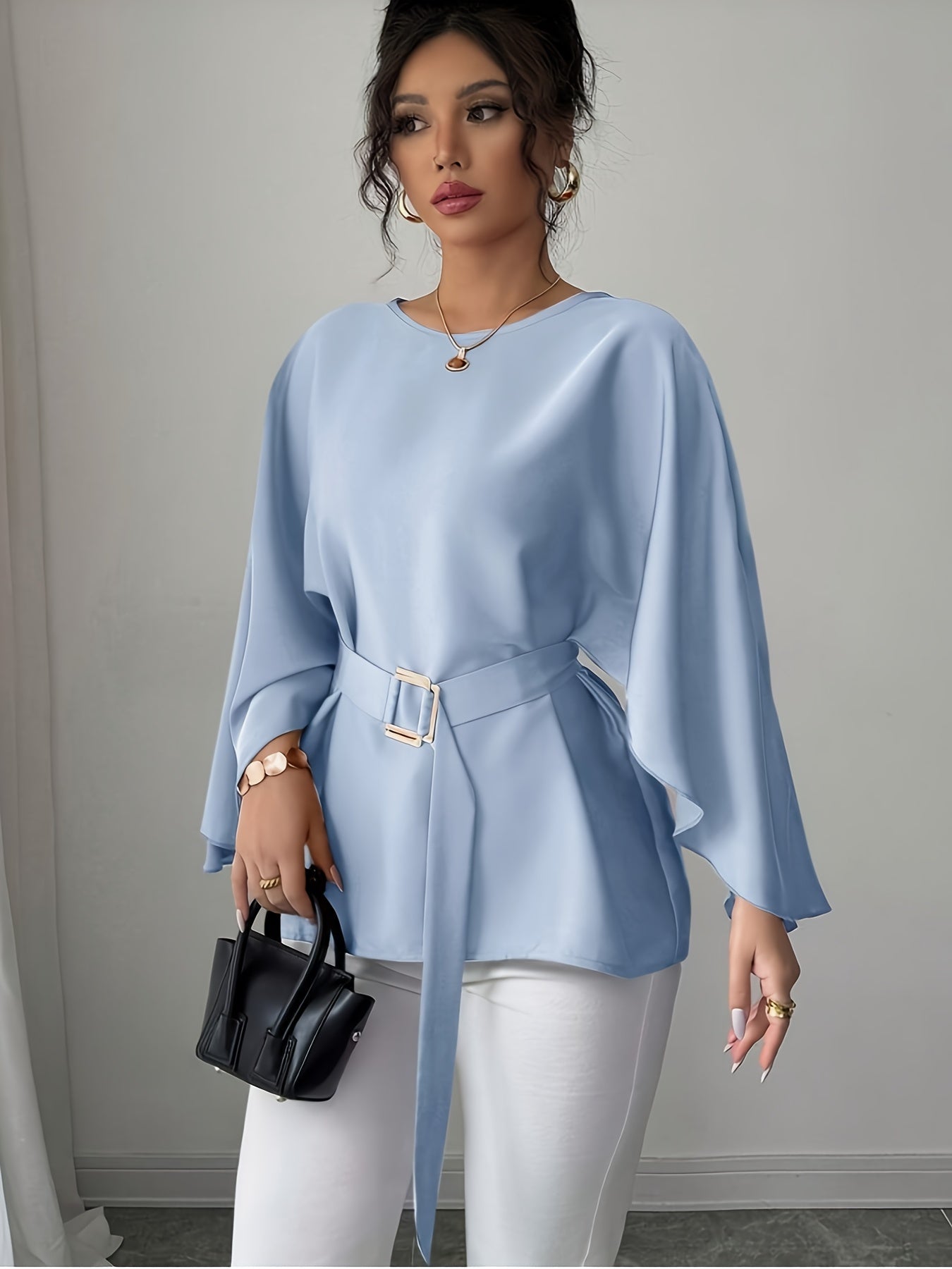 Light blue SHOWLU FASHION long sleeve belted blouse with crew neck, elegant and stylish for casual or office wear.