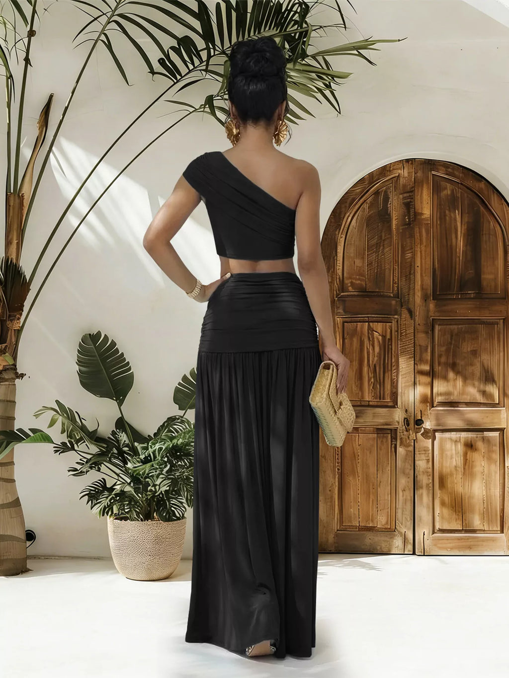 One-shoulder top and ruched maxi skirt set by Trendsi, featuring a stylish, coordinated ensemble in soft fabric.