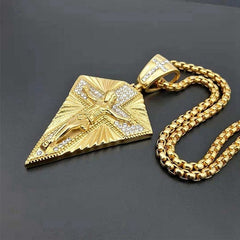 A gold-toned hip hop cross pendant necklace featuring a crucifix figure and embedded crystals.