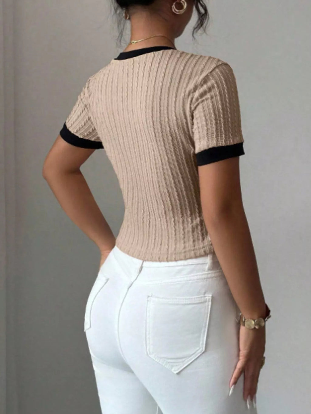 Contrast trim short sleeve T-shirt by Trendsi featuring a casual fit and stylish design, shown in the image.