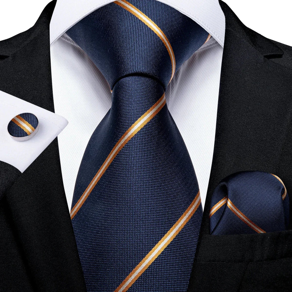 Navy blue solid silk men's tie set with matching cufflinks and pocket square, suitable for business or wedding attire.