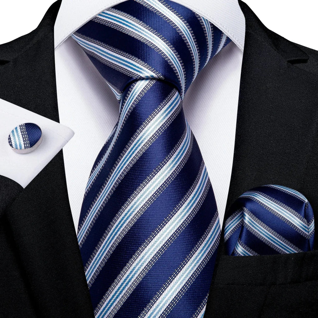Navy blue solid silk tie set for men with matching cufflinks and pocket square, perfect for business or wedding attire.
