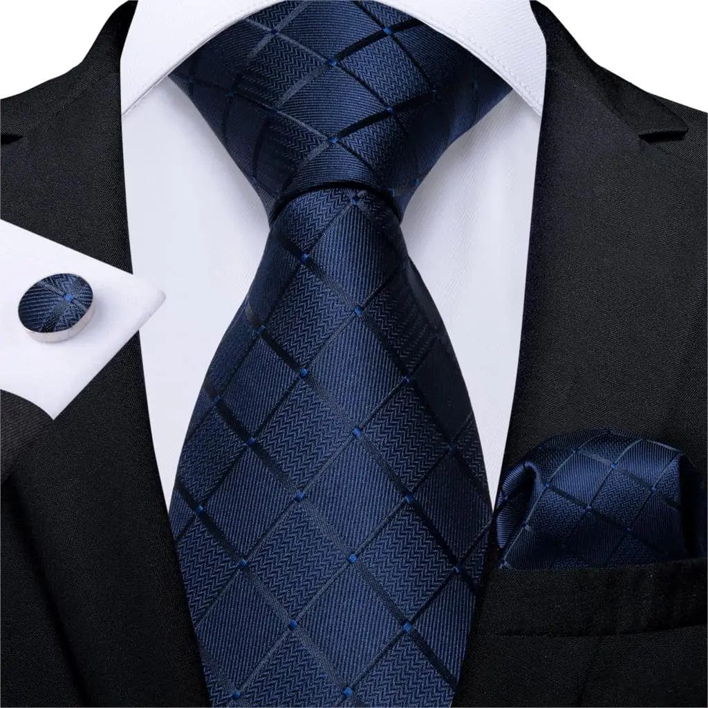 Navy blue solid silk tie set for men with cufflinks, includes a matching pocket square, ideal for business or wedding attire.