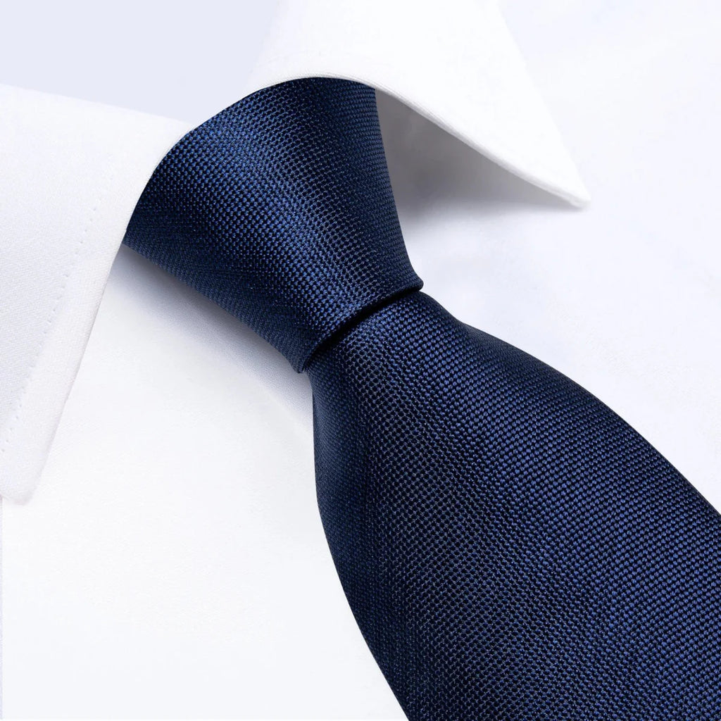 DiBanGu navy blue solid silk tie set for men featuring necktie, matching handkerchief, and cufflinks, ideal for business or formal occasions.