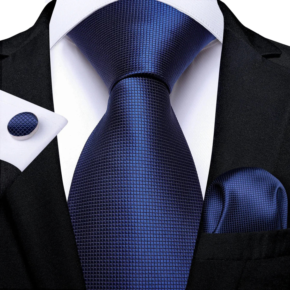 Navy blue solid silk tie set for men including necktie, cufflinks, and pocket square, perfect for business and wedding attire.