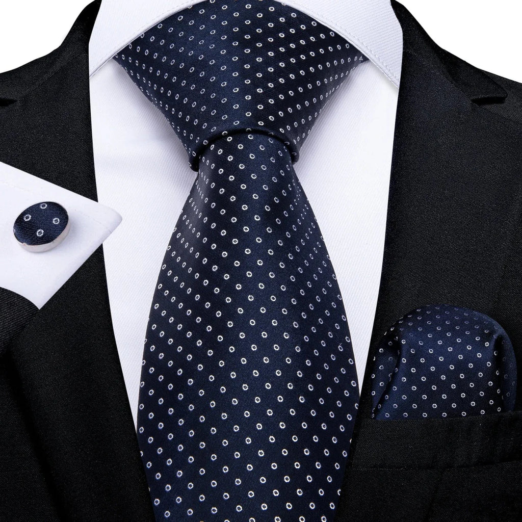 Navy blue solid silk tie set for men featuring cufflinks, matching pocket square, and silk necktie for business or wedding attire.
