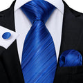 Navy blue silk tie set for men with matching cufflinks and handkerchief, ideal for business or wedding attire.