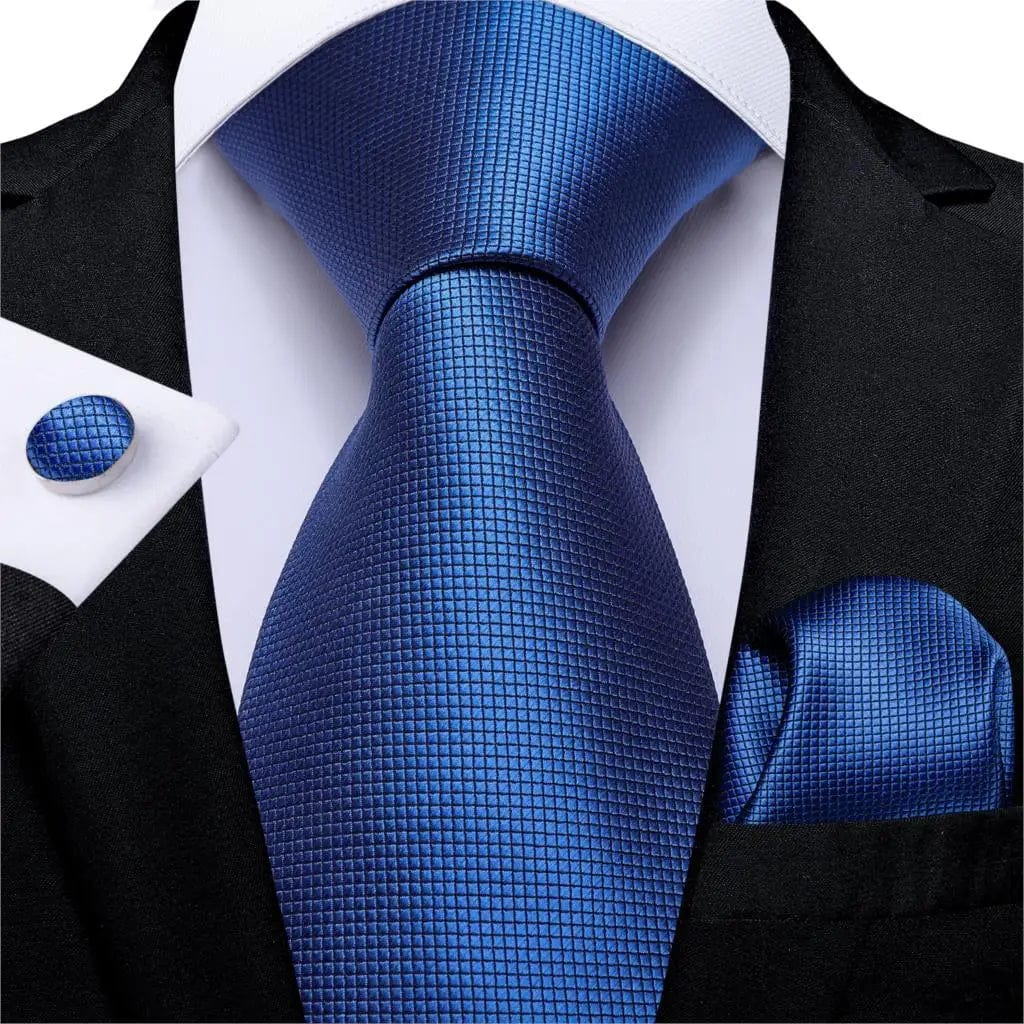 Navy blue solid silk tie set for men with matching cufflinks and pocket square, featuring a classic necktie for business or wedding attire.