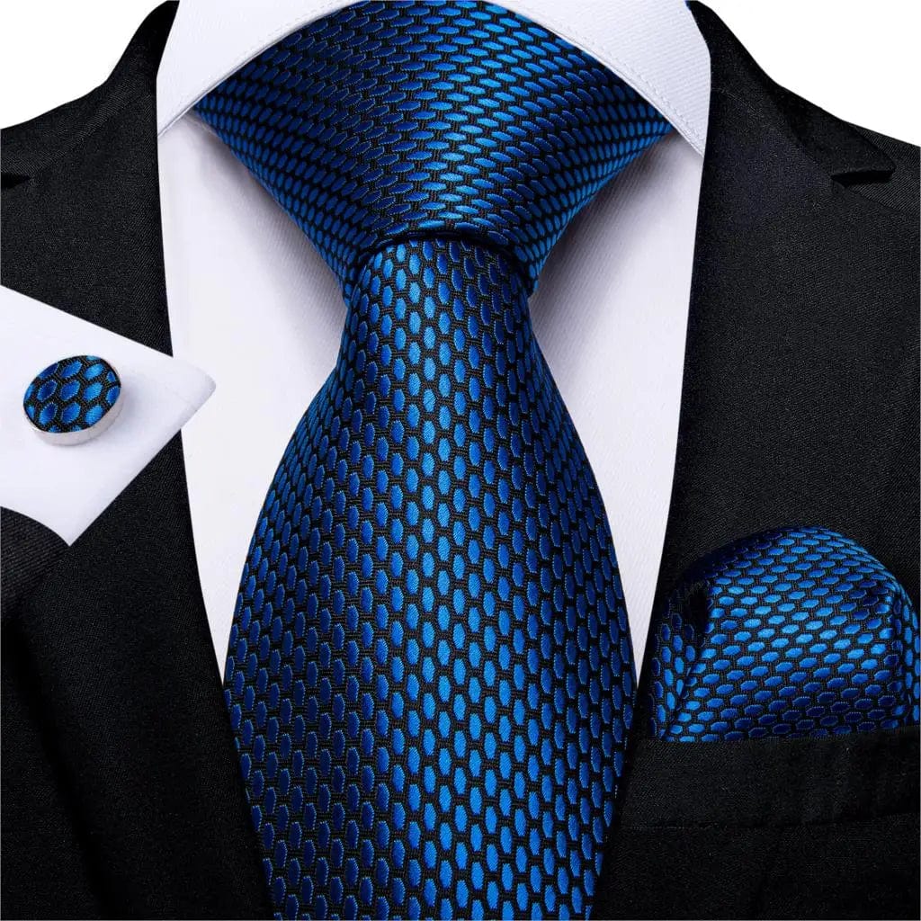 Navy blue silk tie set for men including necktie, cufflinks, and pocket square, stylish accessory for business and formal occasions.